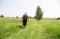 Birutė, born in 1932, walks toward the tree planted at the spot where several groups of Communists and Jews were shot during the first days of the German occupation © Jordi Lagoutte – Yahad - In Unum